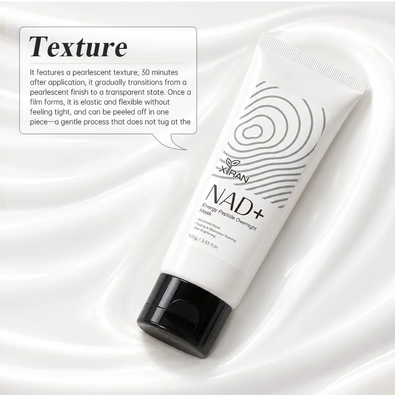NAD+ Energy Peptide Overnight Mask by XiRan in white and black packaging, placed on a glossy, silky fabric background with product details about its pearlescent texture and gentle application.